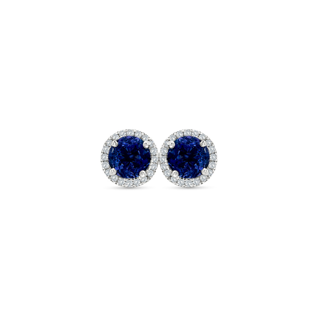 Round Tanzanite & Diamond Halo Stud Earrings" Tanzanite Detail: "Vibrant Round Tanzanite Gemstone" Diamond Halo: "Halo of Diamonds Surrounding Tanzanite" Earring Set: "Elegant Set of Tanzanite & Diamond Stud Earrings" Liner Options: "Earrings with Different Open Liners for Customization" Radiant Beauty: "Sparkling Tanzanite & Diamond Halo Stud Earrings"