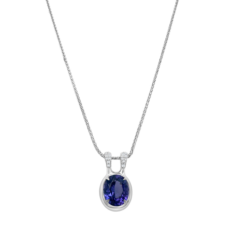 "Oval Cut Tanzanite & Diamond Pendant," "Tanzanite and Diamond Necklace," "Fine Jewelry," "Luxury Pendant," "Fashion Pendant," "Tanzanite Jewelry," "Sparkling Pendant," "Statement Necklace," "Elegant Jewelry," "Special Occasion Pendant," "Tanzanite and Diamond Necklace," "Timeless Jewelry," "Handcrafted Pendant," "Gemstone Pendant," "Classic Tanzanite Pendant."