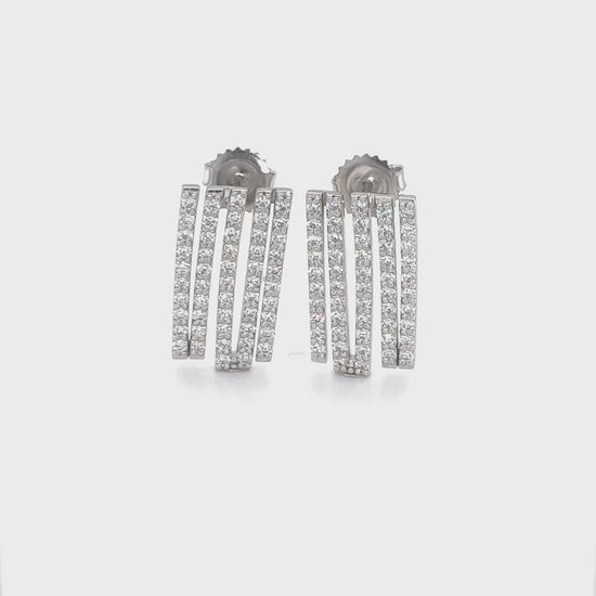 Round brilliant diamond drop earrings, sparkling jewelry, elegant accessories, glamorous fashion, sophisticated style, luxurious adornments, exquisite craftsmanship, refined beauty.