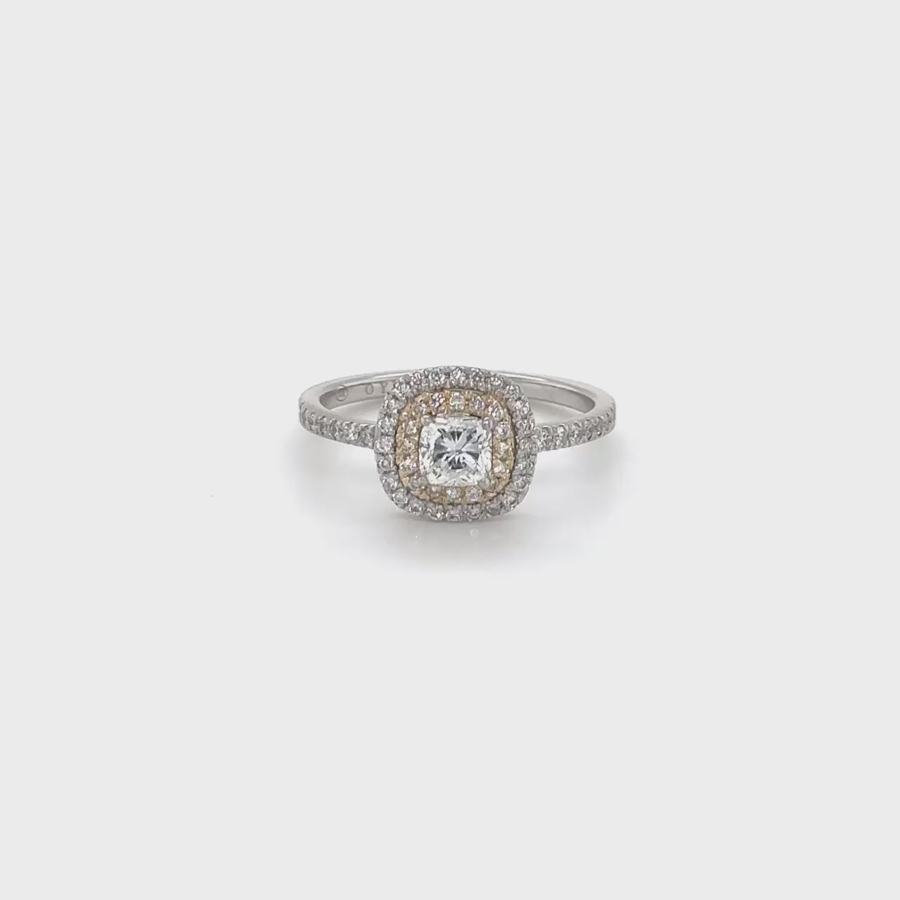 A stunning cushion-cut diamond ring, featuring a double halo design, crafted to perfection, ideal for special occasions, showcasing timeless elegance, with brilliant sparkle, making a statement, symbolizing everlasting love.