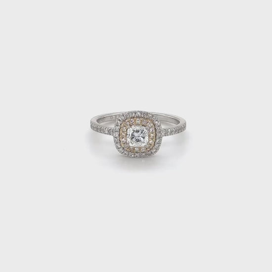 A stunning cushion-cut diamond ring, featuring a double halo design, crafted to perfection, ideal for special occasions, showcasing timeless elegance, with brilliant sparkle, making a statement, symbolizing everlasting love.