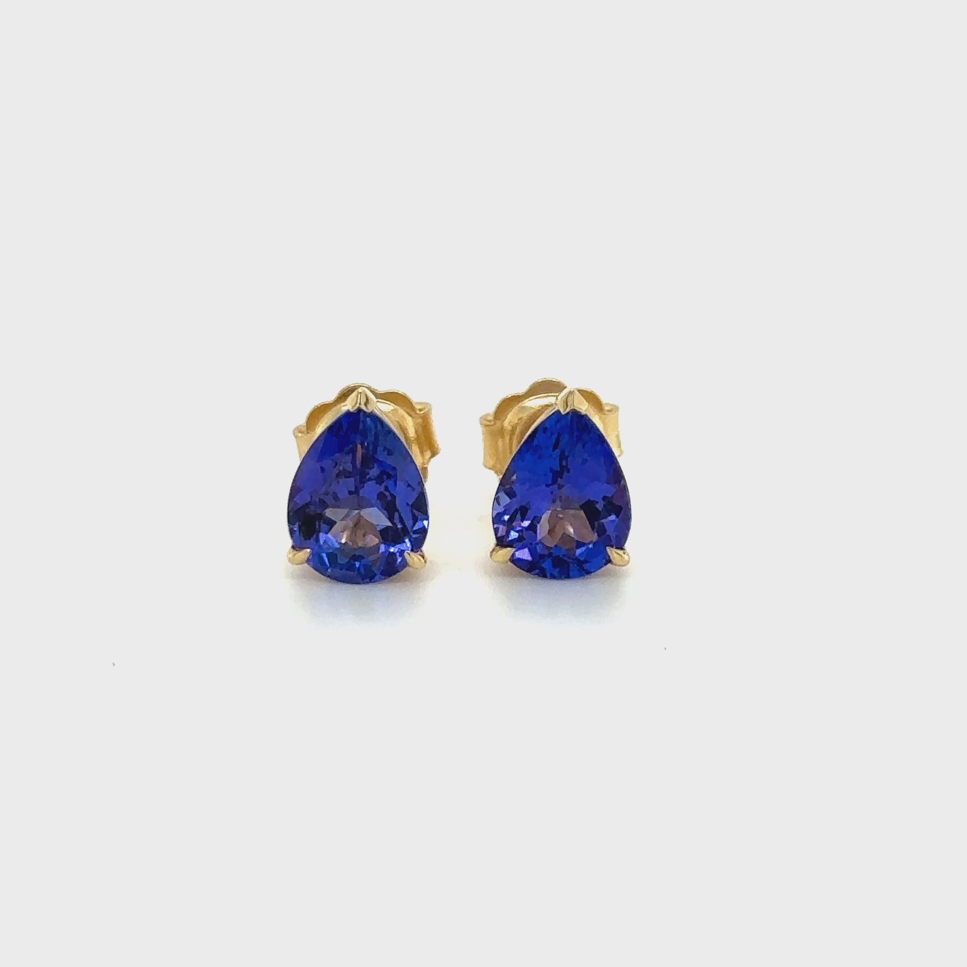 "Pear-shaped tanzanite earrings, Tanzanite stud earrings, Pear earrings, Tanzanite jewelry, Stud earrings, Gemstone earrings, Blue gemstone earrings, Elegant earrings, Classic earrings, Fine jewelry"