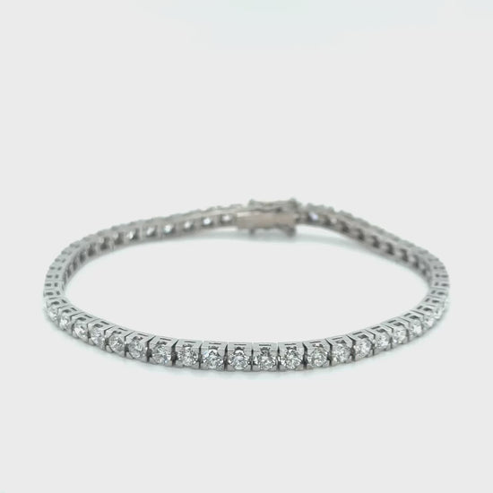 A stunning diamond tennis bracelet, featuring brilliant diamonds, perfect for any occasion, adding elegance and glamour to your look, a timeless accessory, sparkling with every movement, exuding sophistication and luxury, a must-have piece for every jewelry collection.