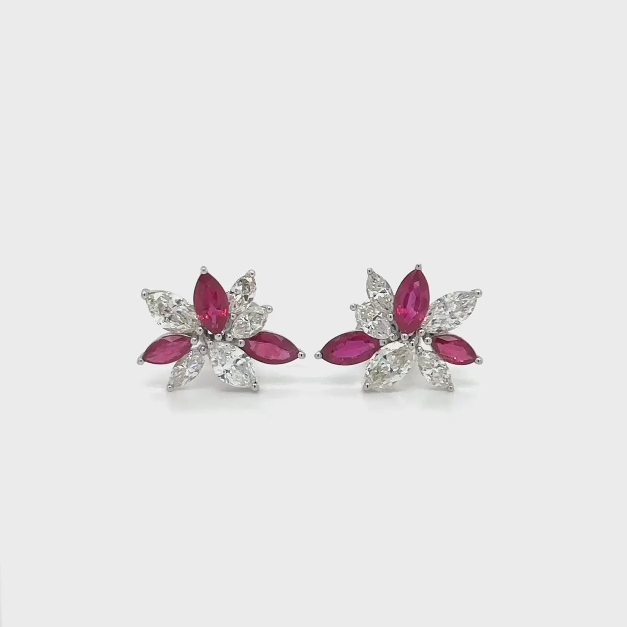 "Ruby & Diamond Stud Earrings," "Ruby Earrings," "Diamond Earrings," "Fine Jewelry," "Luxury Earrings," "Fashion Earrings," "Ruby Jewelry," "Sparkling Stud Earrings," "Statement Earrings," "Elegant Jewelry," "Special Occasion Earrings," "Ruby and Diamond Studs," "Timeless Jewelry," "Handcrafted Earrings," "Gemstone Stud Earrings."