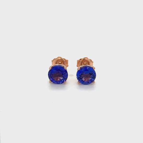 "Round Tanzanite Stud Earrings," "Tanzanite Studs," "Tanzanite Jewelry," "Gemstone Earrings," "Elegant Tanzanite Studs," "Classic Tanzanite Jewelry," "Round Gemstone Earrings," "Tanzanite Accessories," "Stylish Stud Earrings," "Blue Gemstone Studs."