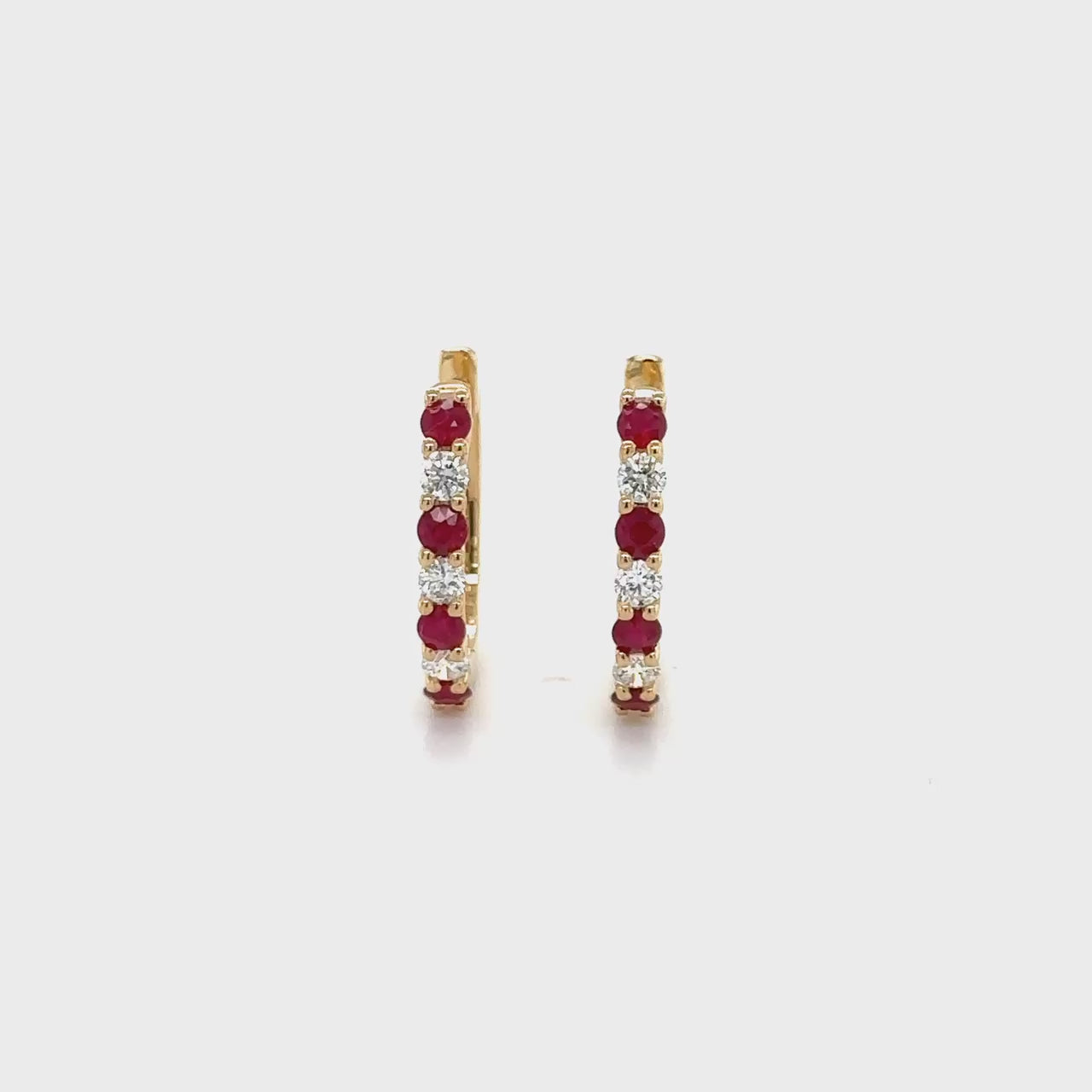 "Round Ruby Earrings, Diamond Huggy Earrings, Red Gemstone Jewelry, Sparkling Diamond Accents, Elegant Earrings, Fashion Accessories, Luxury Jewelry, Fine Jewelry, Glamorous Earrings, Statement Earrings, Precious Gemstone Earrings, Stylish Accessories, High-Quality Jewelry, Classy Earrings, Stunning Ruby and Diamond Earrings"