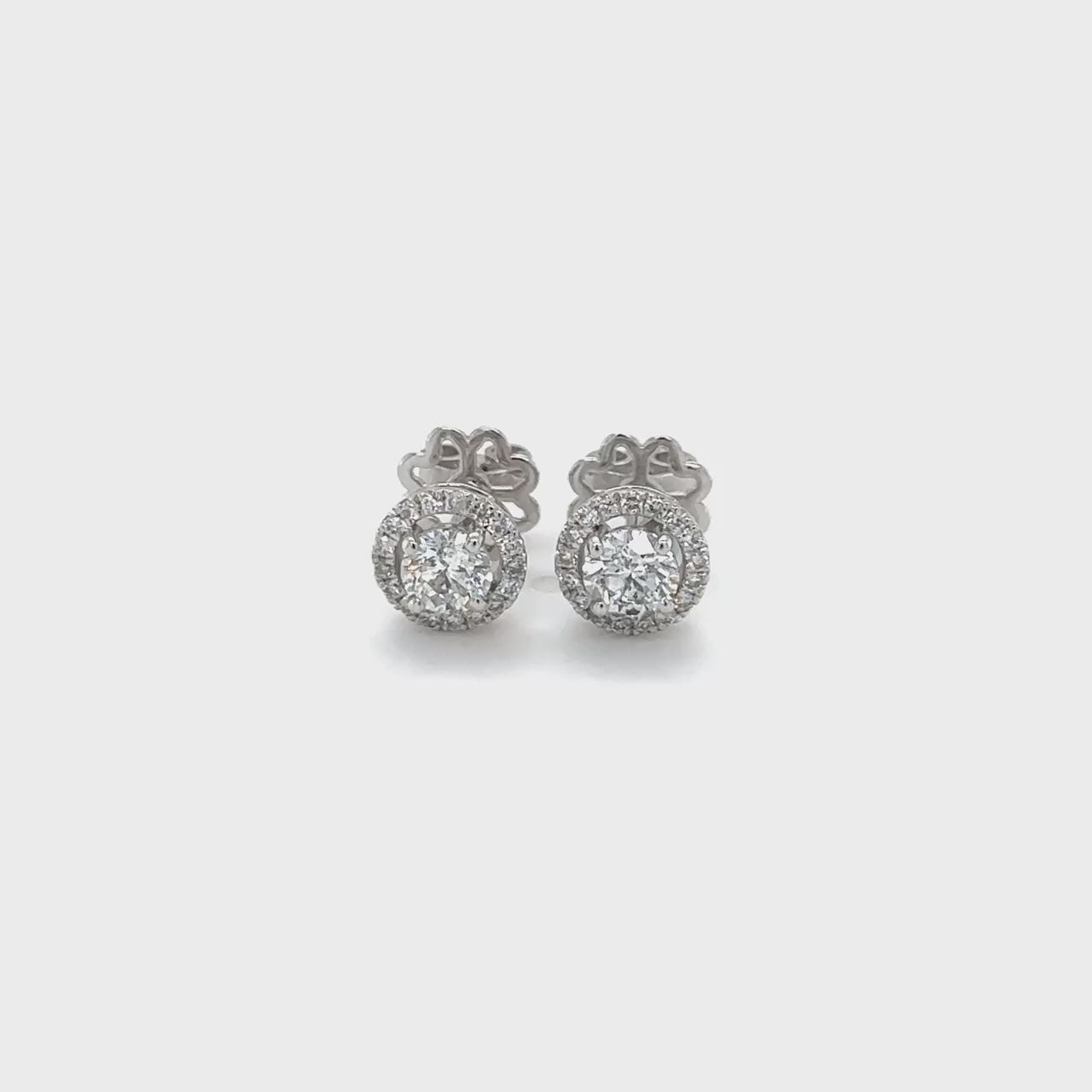 Round Brilliant Diamond Halo Stud Earrings: Sparkling studs, Brilliant halo diamonds, Classic elegance, Timeless sophistication, Perfect for any occasion, Versatile style, Radiant sparkle, Effortless glamour, Luxurious accessories, Must-have jewelry.