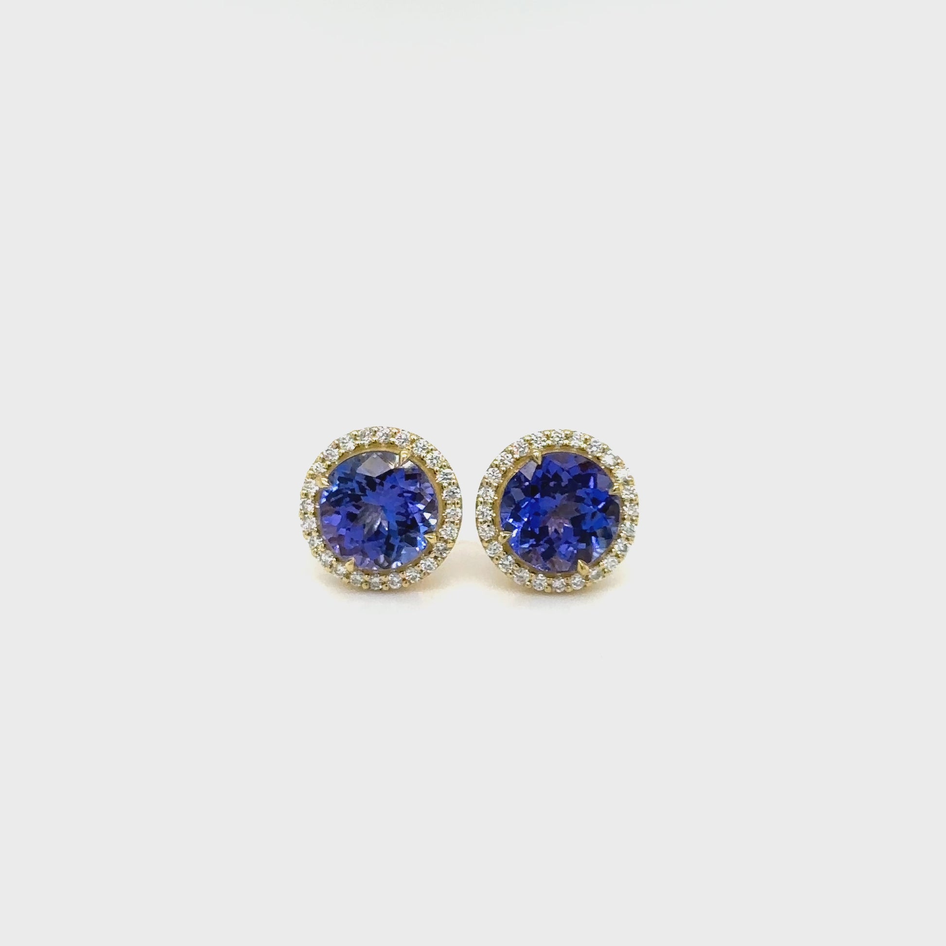 Elevate your style with our 4.10ct Tanzanite & Diamond Halo Stud Earrings, a true masterpiece in jewelry design. Experience the allure of tanzanite and the sparkle of diamonds with our exquisite 4.10ct Tanzanite & Diamond Halo Stud Earrings. Make a statement of elegance with these 4.10ct Tanzanite & Diamond Halo Stud Earrings, a perfect blend of luxury and sophistication.