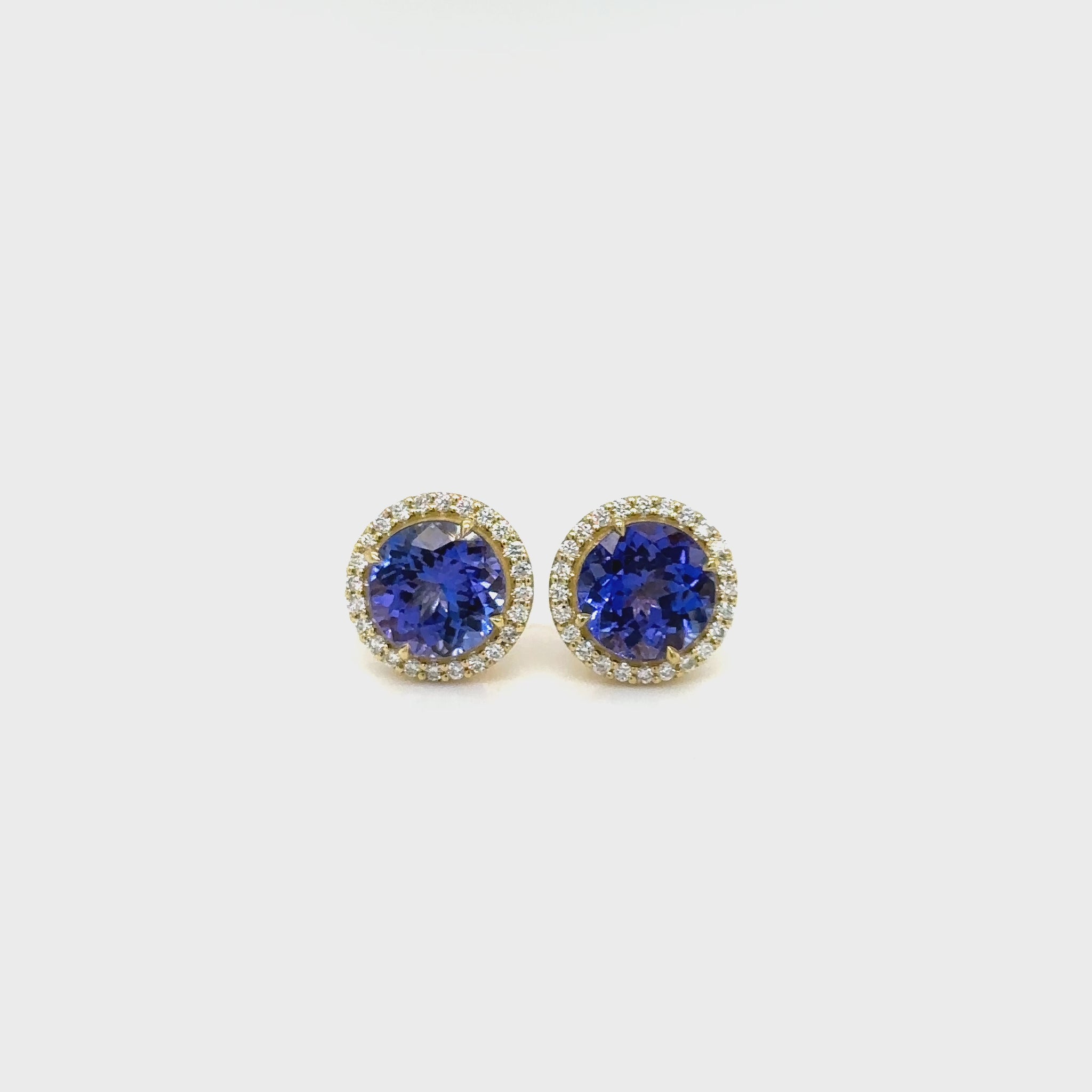 Elevate your style with our 4.10ct Tanzanite & Diamond Halo Stud Earrings, a true masterpiece in jewelry design. Experience the allure of tanzanite and the sparkle of diamonds with our exquisite 4.10ct Tanzanite & Diamond Halo Stud Earrings. Make a statement of elegance with these 4.10ct Tanzanite & Diamond Halo Stud Earrings, a perfect blend of luxury and sophistication.