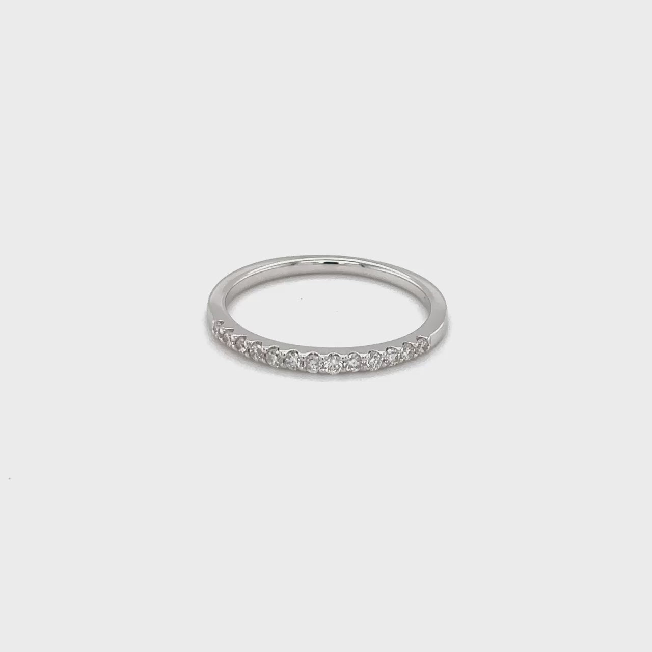 A sparkling, Round Brilliant Half Eternity Diamond Ring, showcasing timeless elegance, exquisite craftsmanship, and unparalleled beauty, perfect for celebrating milestones, symbolizing eternal love, and adding a touch of luxury to any ensemble.
