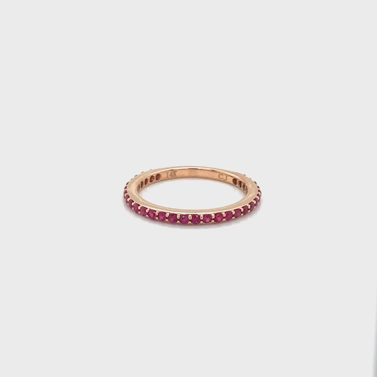 "Round Ruby Eternity Ring," "Ruby Eternity Band," "Red Gemstone Ring," "Eternity Ring with Rubies," "Round Cut Ruby Ring," "Elegant Ruby Jewelry," "Luxury Ruby Ring," "Gemstone Eternity Ring," "Fine Ruby Accessories," "Statement Ruby Ring," "High-Quality Ruby Jewelry."