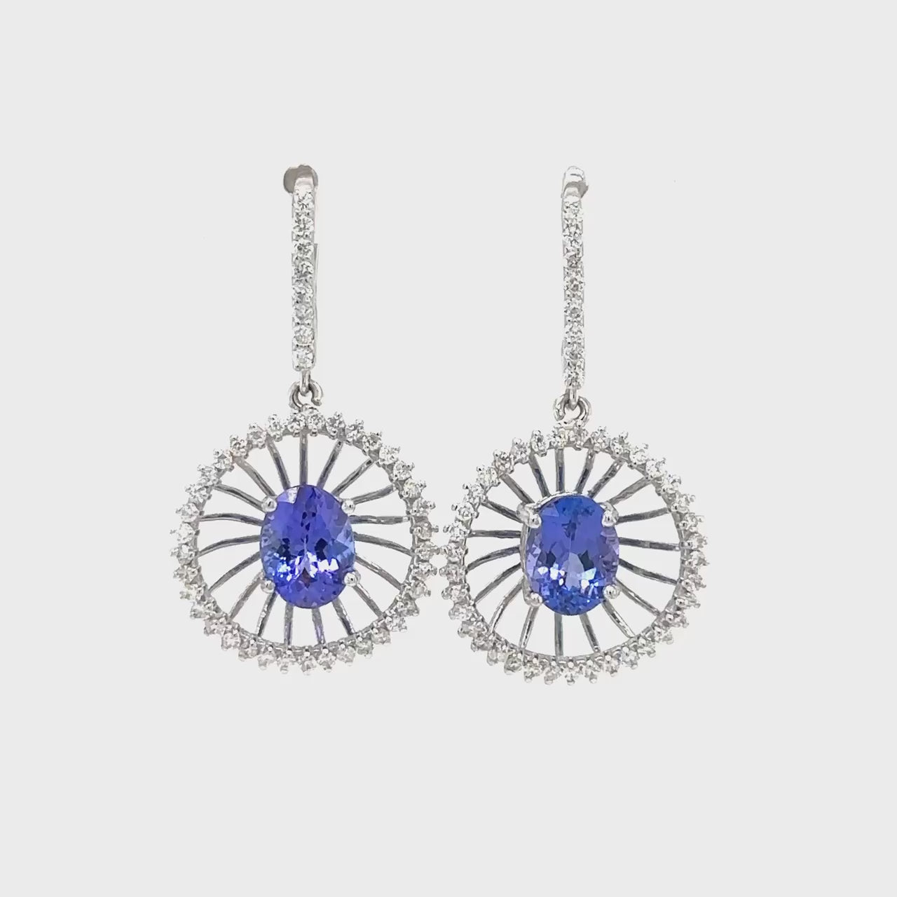 Oval Tanzanite and Diamond Drop Earrings, Oval Tanzanite Earrings, Diamond Drop Earrings, Tanzanite and Diamond Jewelry, Elegant Tanzanite Earrings, Luxurious Drop Earrings, Gemstone Earrings with Diamonds, Fine Jewelry Tanzanite, Oval Cut Tanzanite Earrings, Sparkling Diamond and Tanzanite Earrings.