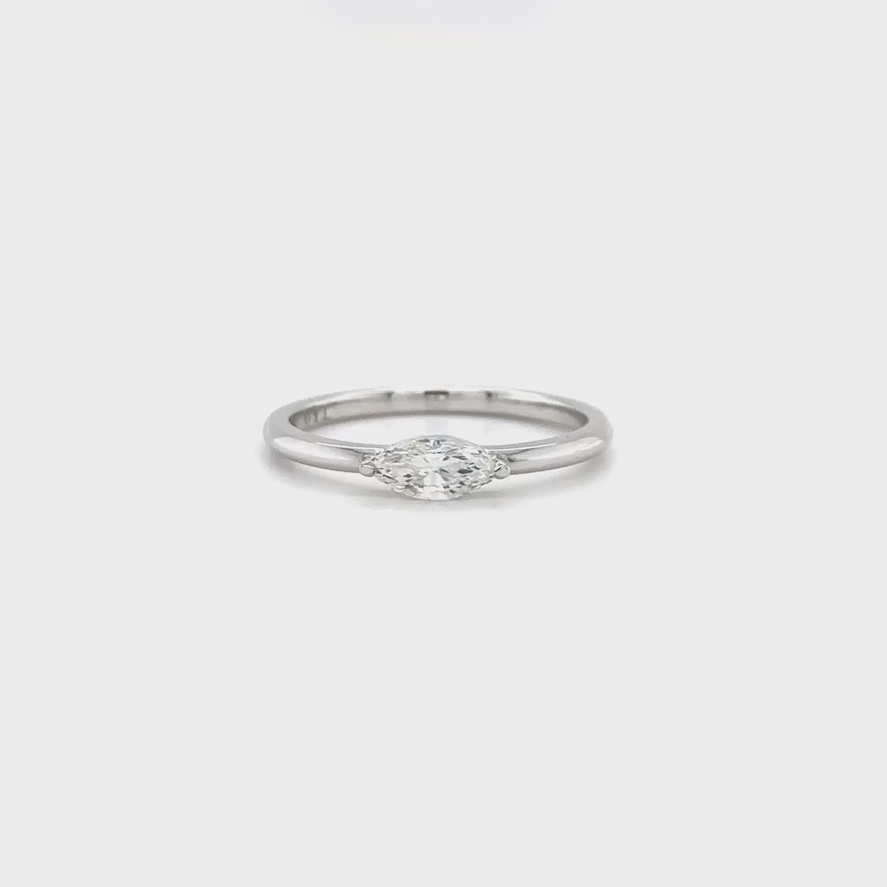 Marquise Solitaire Diamond Ring: elegant engagement ring, single stone diamond band, classic solitaire design, luxurious bridal jewelry, timeless engagement piece