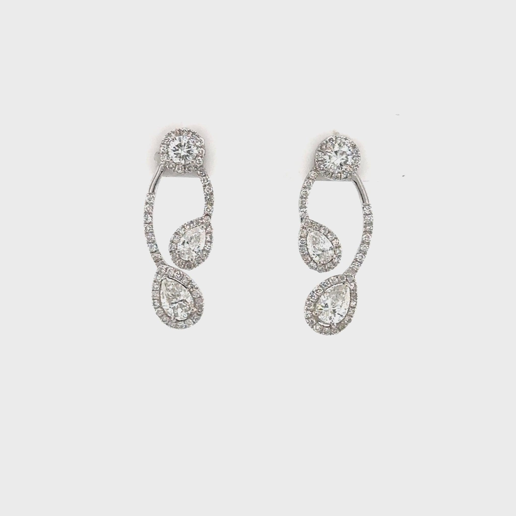 "Pear & Diamond Drops Earrings," "Exquisite Pear Shaped Diamond Drop Earrings," "Luxurious Diamond Drop Earrings," "Elegant Pear & Diamond Drop Earrings," "Fine Jewelry with Pear and Diamond Drops," "High-Quality Diamond Drop Earrings," "Statement Pear Shaped Diamond Earrings," "Sparkling Pear & Diamond Drop Earrings," "Beautiful Pear Shaped Diamond Drop Earrings," "Fashionable Diamond Drop Earrings with Pear Shapes."