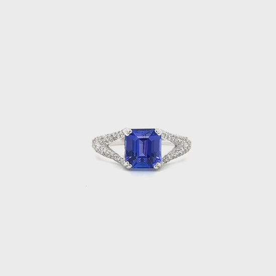 Emerald Cut Tanzanite Ring, Diamond Split Shank Ring, Tanzanite and Diamond Jewelry, Elegant Tanzanite Ring, Luxury Gemstone Ring, Split Shank Design, Emerald Cut Gemstone, Tanzanite Engagement Ring, Fine Jewelry, Statement Ring, December Birthstone Ring, Unique Tanzanite Ring, Tanzanite and Diamond Ring, Tanzanite Split Shank Ring, Tanzanite Jewelry for Women.