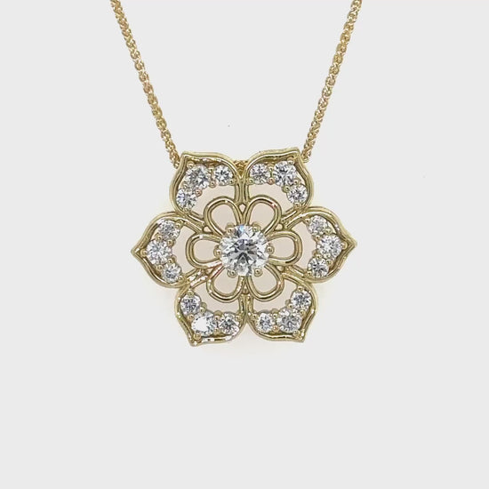 Round brilliant pendant," "Floral shaped pendant," "Diamond necklace," "Floral diamond pendant," "Luxury jewelry," "Fine diamond jewelry," "Sparkling pendant," "Elegant accessory," "Statement piece," "Gift of elegance," "Jewelry for special occasions."