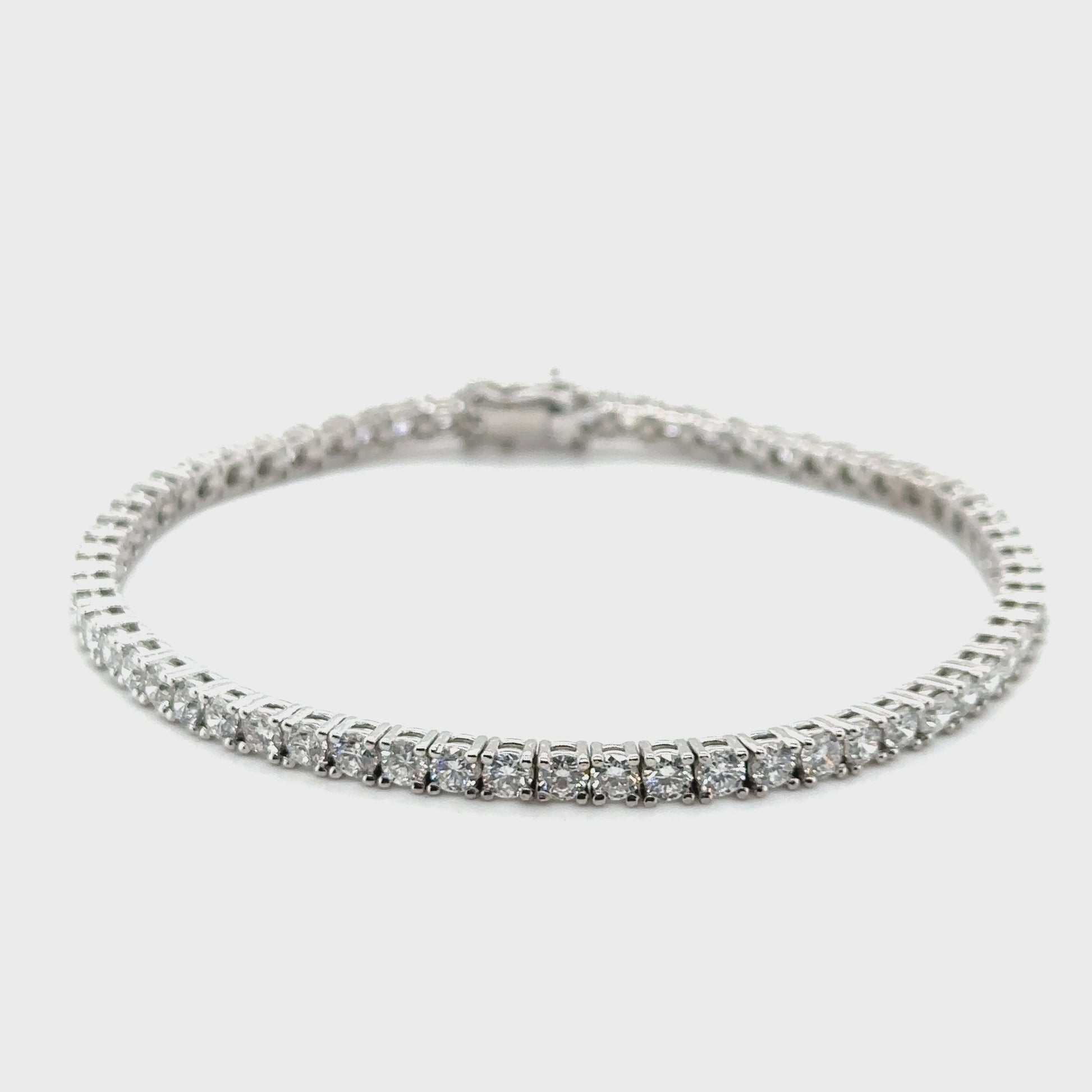 A sparkling diamond tennis bracelet, elegant jewelry accessory, wrist adornment, luxury diamond accessory, sophisticated bracelet, classic diamond jewelry piece.