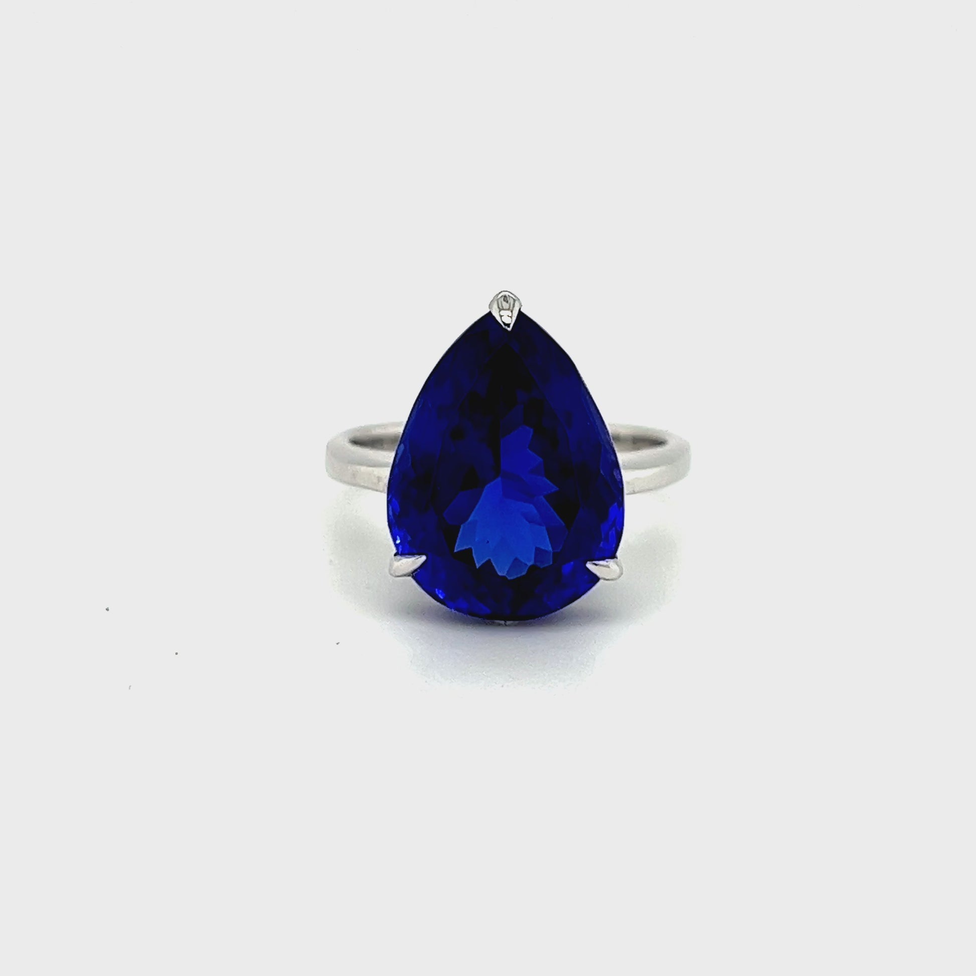 Alt tag: "Pear-Shaped Tanzanite Solitaire Ring" Alt tag: "11.30ct Tanzanite Gemstone Ring" Alt tag: "Luxury Violet-Blue Tanzanite Jewelry" Alt tag: "Elegant Pear-Cut Solitaire Ring" Alt tag: "Genuine Tanzanite Engagement Ring" Alt tag: "Fine Jewelry with Lustrous Metal Band" Alt tag: "Statement Tanzanite Accessory"