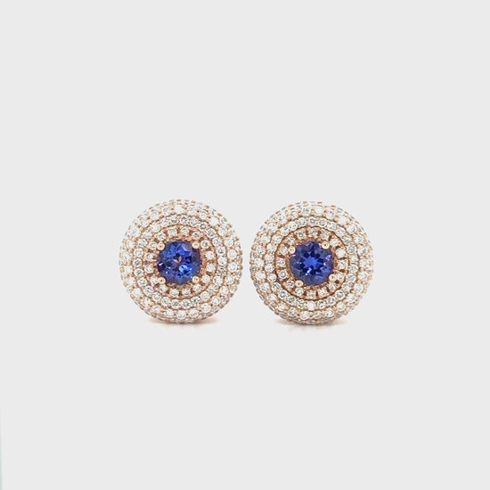 Exquisite Round Tanzanite Triple Halo Diamond Studs, elegant gemstone earrings, luxurious Tanzanite studs, sparkling diamond accents, triple halo design, statement jewelry, fine gemstone studs, sophisticated earrings, radiant Tanzanite stones, dazzling diamond brilliance.