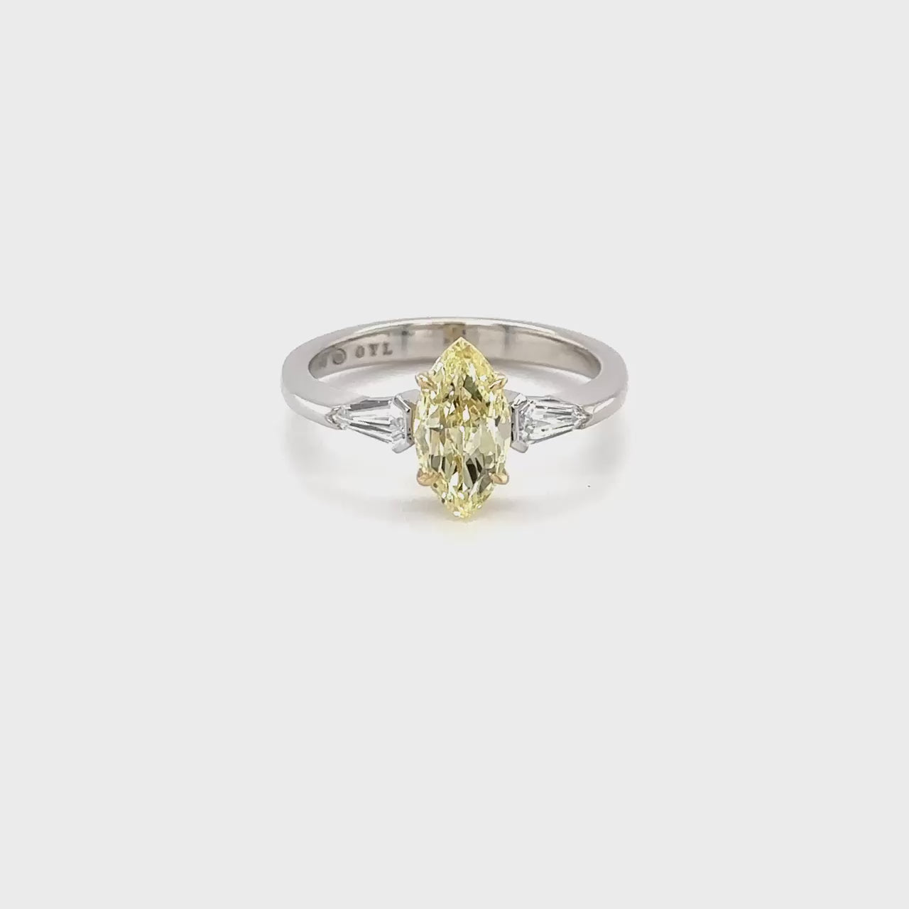 A breathtaking Marquise Cut diamond takes center stage, flanked by two exquisite Triangle Cut diamonds in a captivating Trilogy design. Crafted with precision and elegance, this ring exudes timeless beauty and sophistication, destined to be cherished for a lifetime.