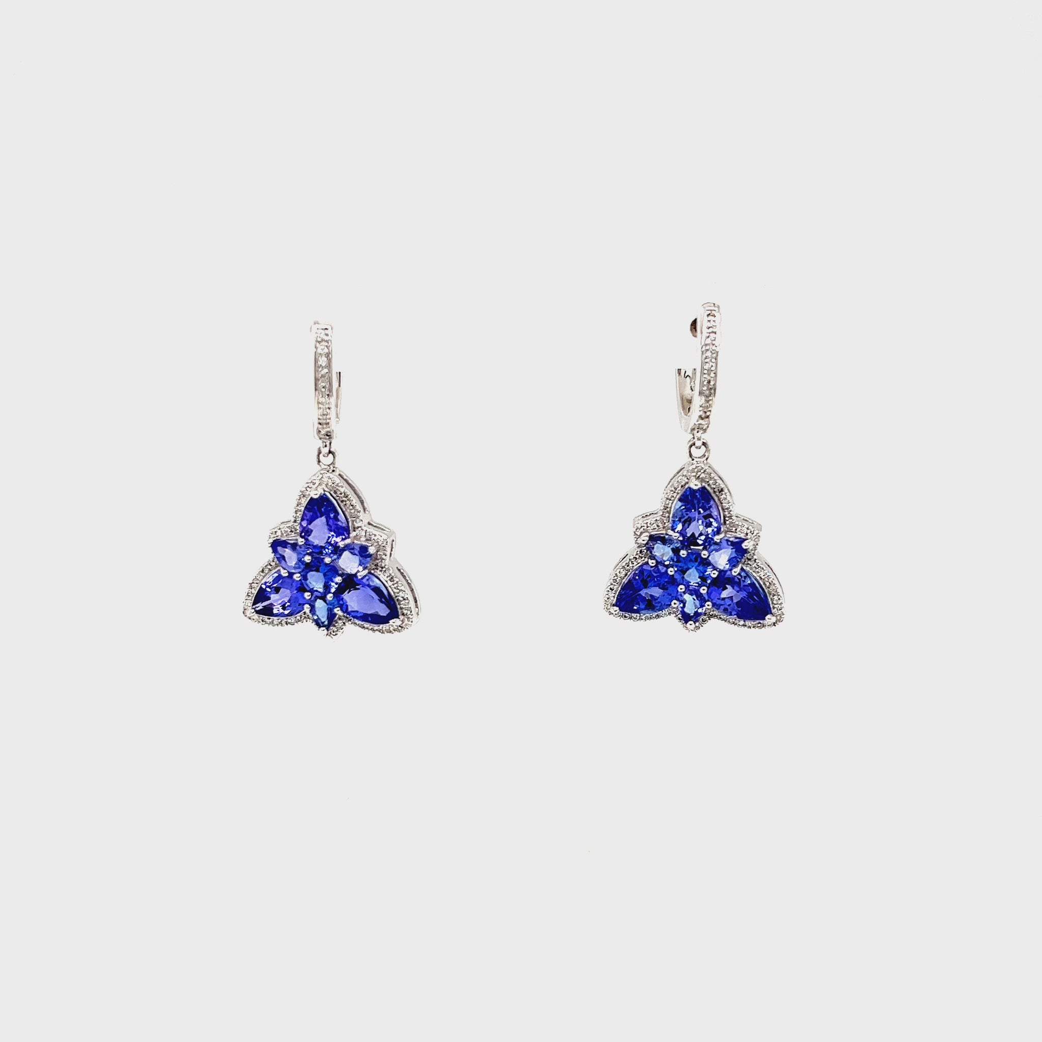 Floral Tanzanite Drop Earrings: Exquisite Tanzanite Gemstone, Elegant Floral Design, Dazzling Drop Style, Sterling Silver Setting, Sparkling Statement Jewelry, Unique Floral Elegance, Beautiful Gemstone Earrings, Feminine and Timeless, Handcrafted Floral Delight, Stunning Tanzanite Accents.