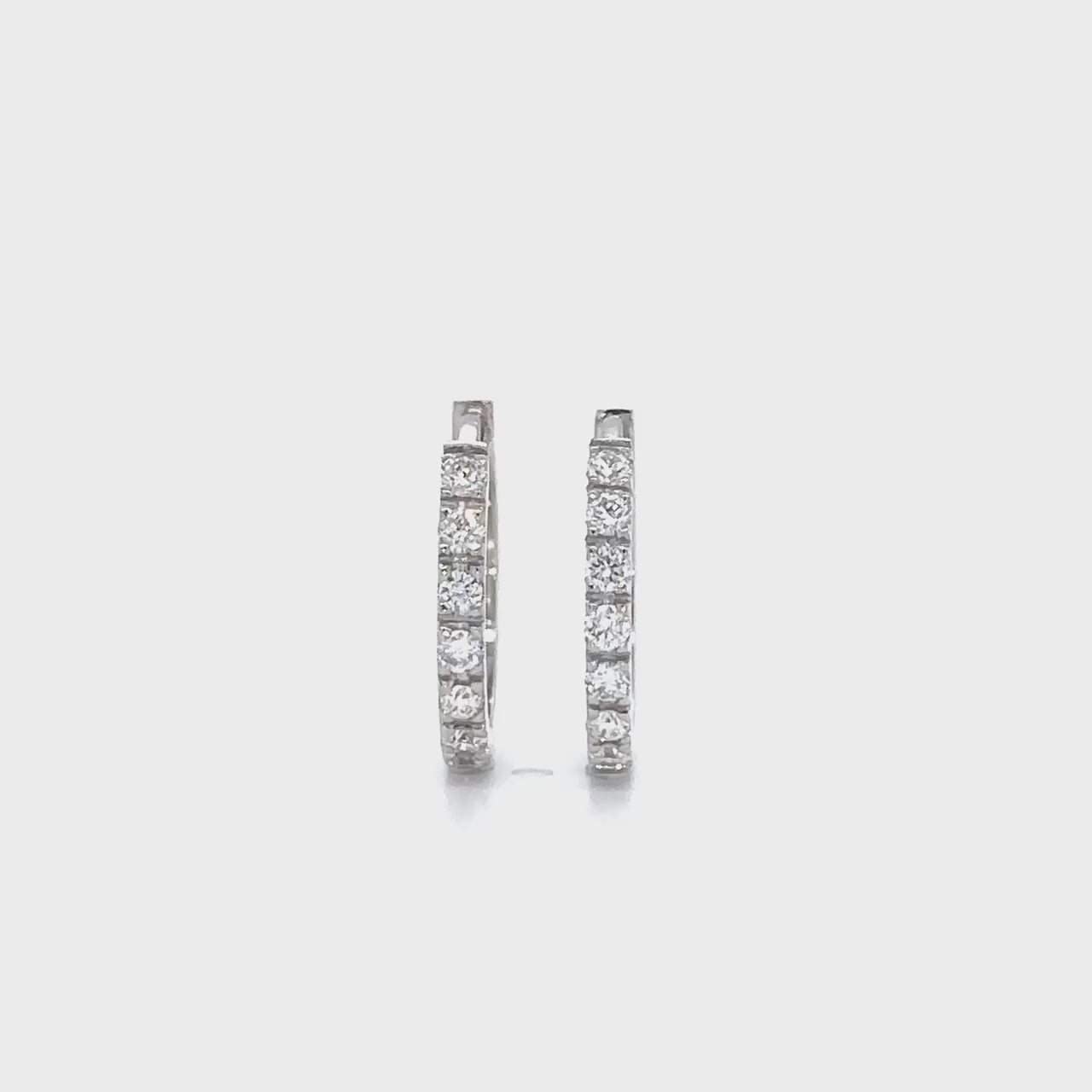 "Round Brilliant Diamond Earrings," "Huggy Earrings," "Diamond Stud Earrings," "Small Diamond Hoops," "Classic Diamond Jewelry," "Everyday Diamond Earrings," "Diamond Huggie Hoops," "Timeless Diamond Accessories."