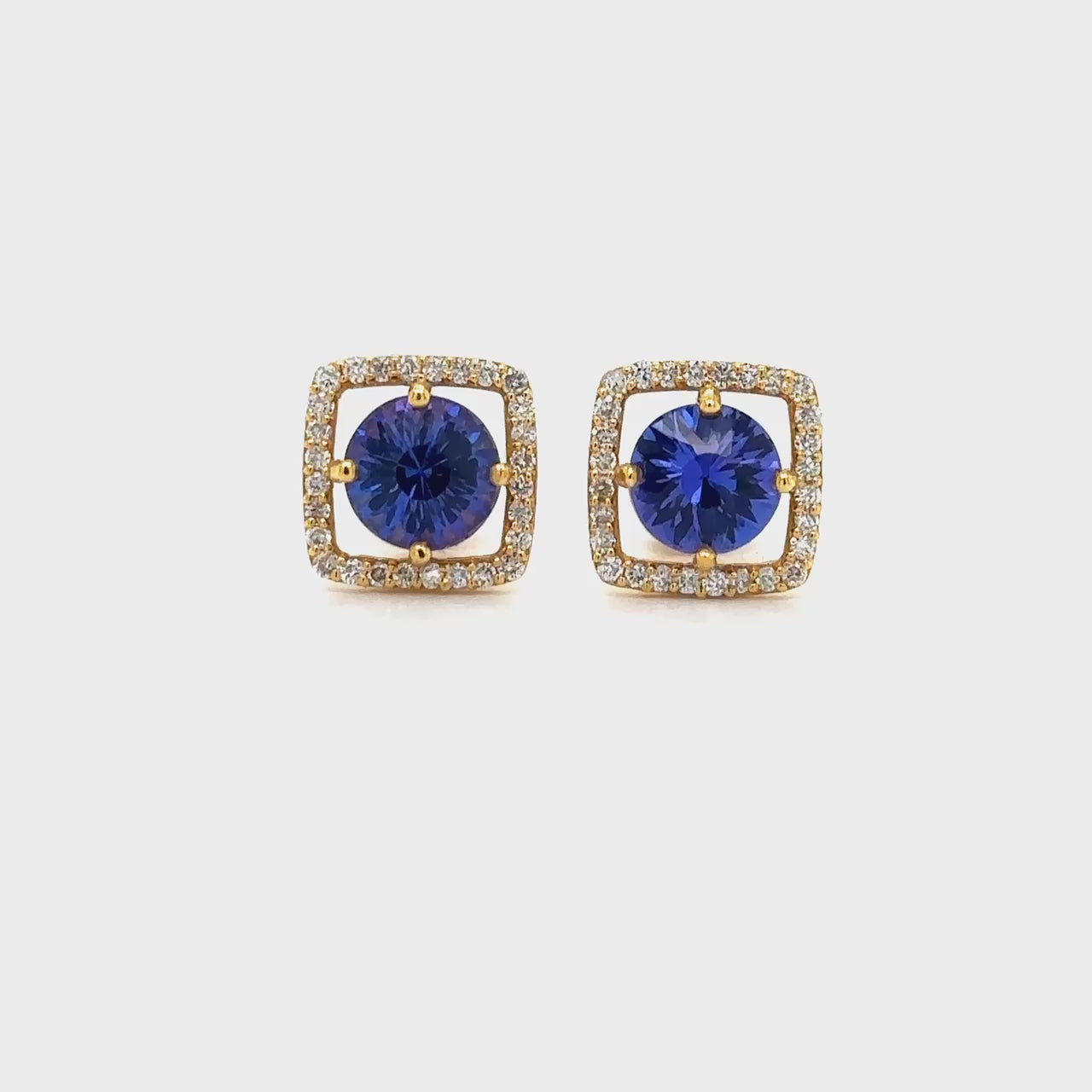 ound Tanzanite & Diamond Halo Stud Earrings" Tanzanite Detail: "Vibrant Round Tanzanite Gemstone" Diamond Halo: "Halo of Diamonds Surrounding Tanzanite" Earring Set: "Elegant Set of Tanzanite & Diamond Stud Earrings" Liner Options: "Earrings with Different Open Liners for Customization" Radiant Beauty: "Sparkling Tanzanite & Diamond Halo Stud Earrings"