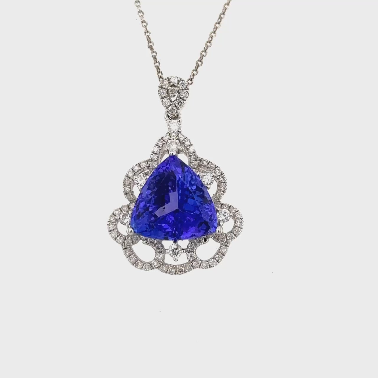 Trillion Tanzanite & Diamond Halo Pendant, Tanzanite pendant, Diamond pendant, Trillion pendant, Halo pendant, Tanzanite and diamond pendant, Trillion tanzanite pendant, Diamond halo pendant.