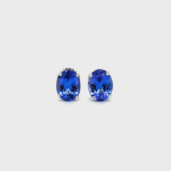 Oval Tanzanite Stud Earrings, elegant tanzanite earrings, sparkling oval studs, precious gemstone jewelry, dazzling gemstone studs, luxurious stud earrings, beautiful tanzanite accessories.