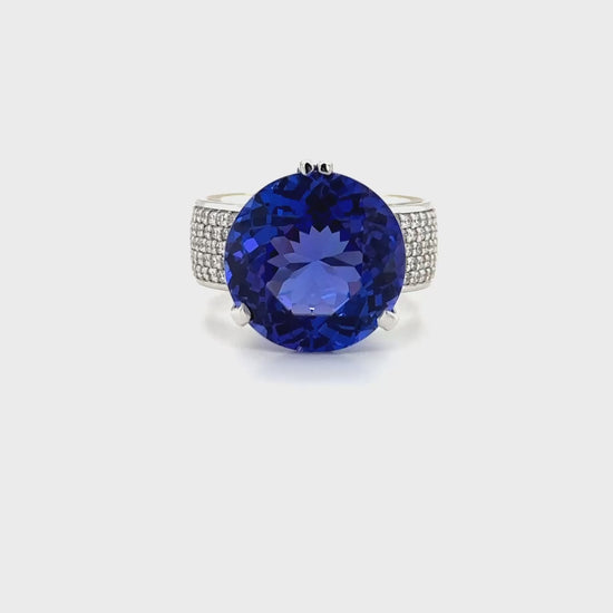 "Round Brilliant Cut Tanzanite & Diamond Ring," "Tanzanite and Diamond Ring," "Fine Jewelry," "Luxury Ring," "Fashion Ring," "Gemstone Jewelry," "Sparkling Diamond Ring," "Statement Ring," "Elegant Jewelry," "Special Occasion Ring," "Round Cut Tanzanite Ring," "Timeless Jewelry," "Handcrafted Ring," "Unique Gemstone Ring," "Classic Diamond Ring."