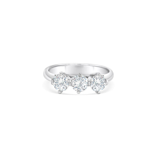 Round brilliant diamond trilogy ring, three-stone diamond ring, sparkling diamond trilogy ring, diamond anniversary ring, classic diamond trilogy ring, elegant three-stone ring, timeless diamond trilogy ring, exquisite diamond trilogy ring, stunning three-stone diamond ring, breathtaking diamond trilogy ring