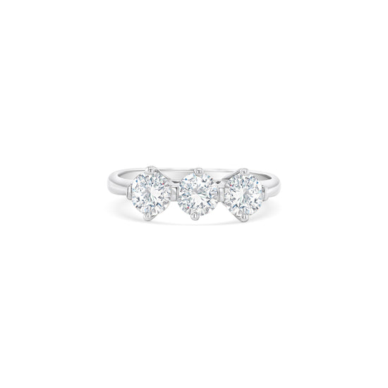 Round brilliant diamond trilogy ring, three-stone diamond ring, sparkling diamond trilogy ring, diamond anniversary ring, classic diamond trilogy ring, elegant three-stone ring, timeless diamond trilogy ring, exquisite diamond trilogy ring, stunning three-stone diamond ring, breathtaking diamond trilogy ring