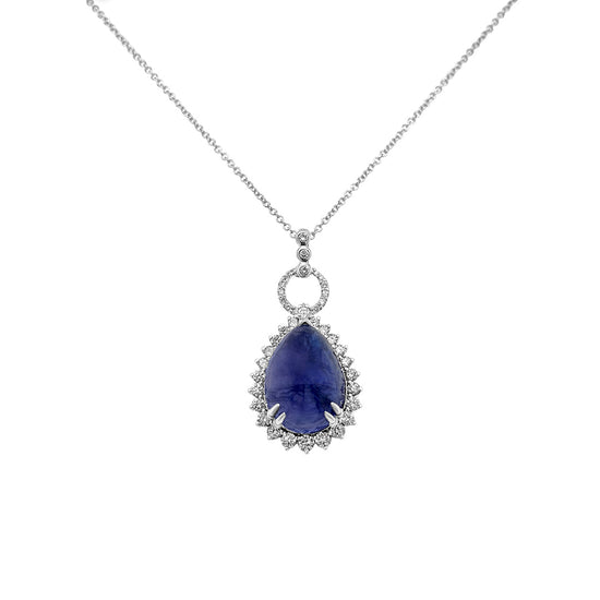 Tanzanite pendant, Pear-shaped Tanzanite, Halo Pendant, Fine Jewelry, Luxury Jewelry, Precious Gemstone, High-End Jewelry, Exclusive Design, Statement Jewelry, Investment Piece, Rare Gemstone, 13.20ct Tanzanite, Scintillating Diamonds, Exquisite Craftsmanship, Opulence and Elegance, Limited Availability, Platinum Setting, 18K White Gold Setting.