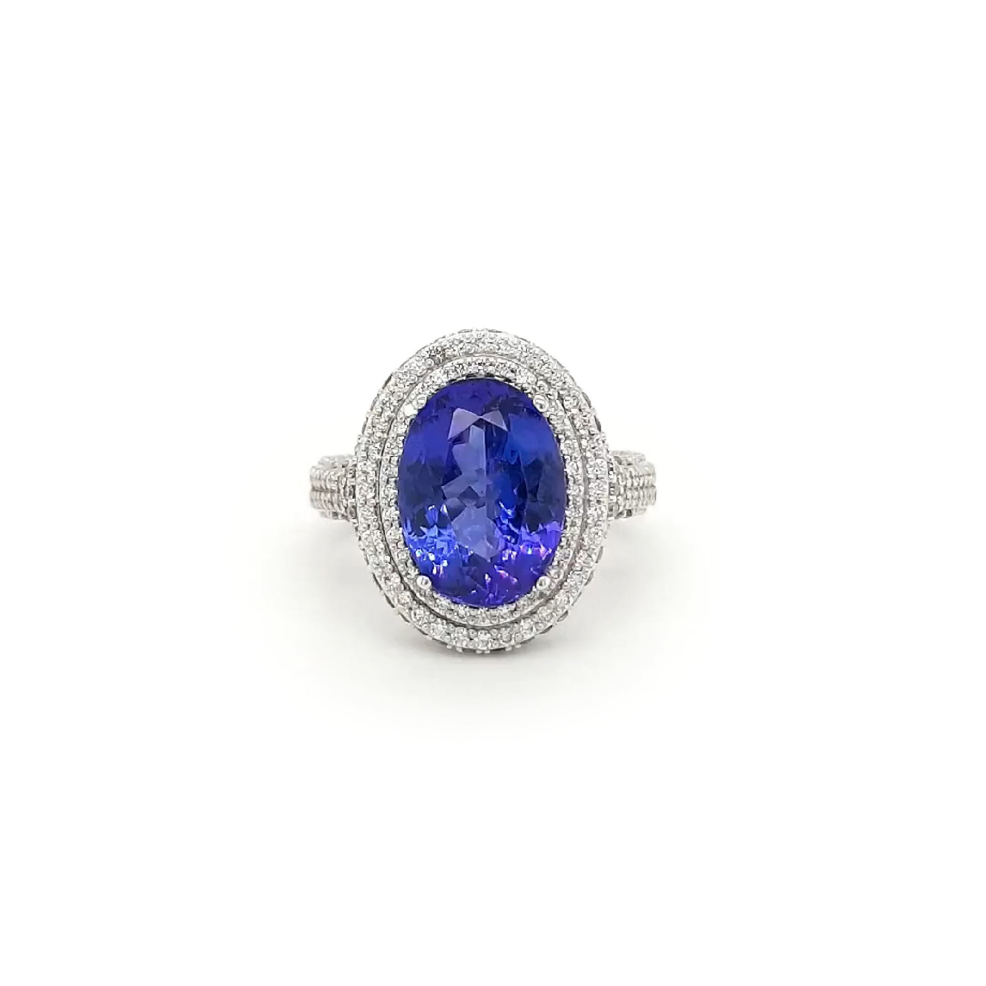 "Oval Tanzanite Ring with Diamond Pave Setting" "Elegant Oval Tanzanite and Diamond Pave Engagement Ring" "Sophisticated Oval-Cut Tanzanite Ring with Pave Diamonds" "Oval Tanzanite and Pave Diamond Halo Ring" "Exquisite Oval Tanzanite Ring Surrounded by Sparkling Diamonds" "Oval-Cut Tanzanite and Diamond Pave Accent Ring" "Chic Oval Tanzanite Ring with a Glittering Diamond Pave Band" "Oval-Shaped Tanzanite and Pave Diamond Encrusted Ring"